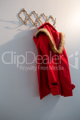 Red hoodie hanging on hook