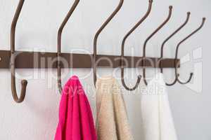 Colorful towels hanging on hook
