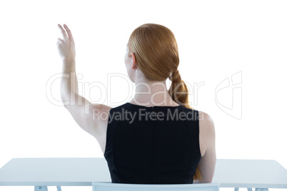 Female executive pretending to use an invisible screen