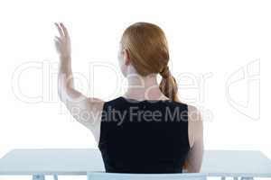 Female executive pretending to use an invisible screen
