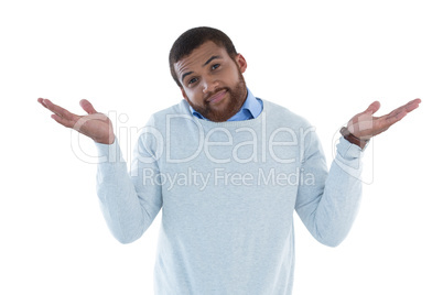 Male executive gesturing against white background