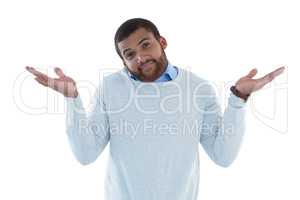 Male executive gesturing against white background