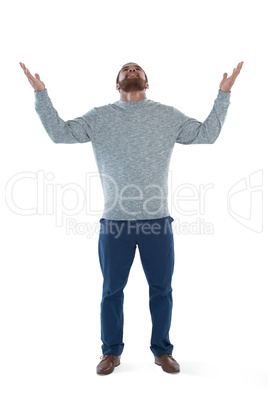 Male executive gesturing against white background