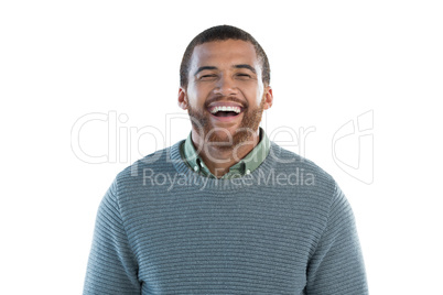 Happy man standing against white background