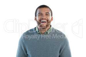 Happy man standing against white background