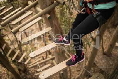 Woman on zipline in adventure park