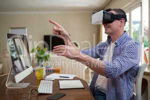 Man using virtual reality headset in living room