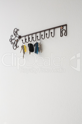 Various keys hanging on hook