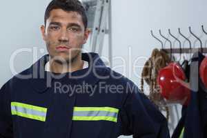 Tiered fireman standing in the office
