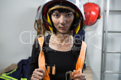 Female architect wearing safety straps