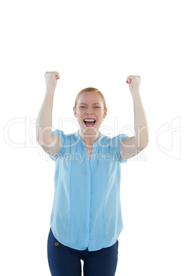 Female executive standing with arms up against white background
