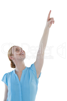 Female executive pointing against white background