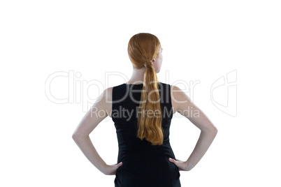 Female executive standing against white background