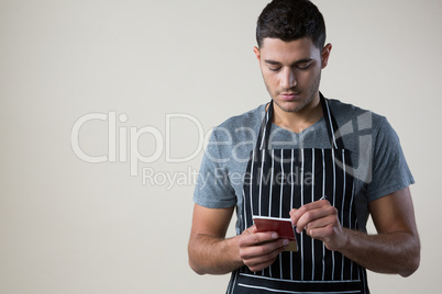 Waiter writing down an order in the notepad