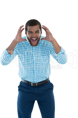 Male executive shouting against white background