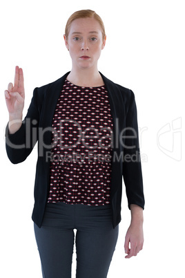 Female executive gesturing against white background