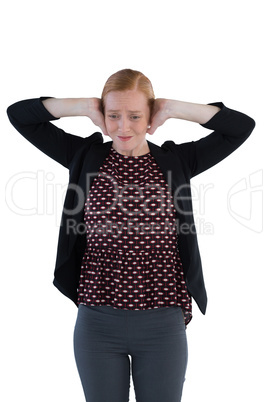 Annoyed woman covering her ears