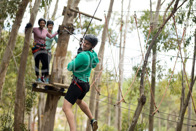 Man on zipline in adventure park