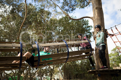 Friends having fun in adventure park