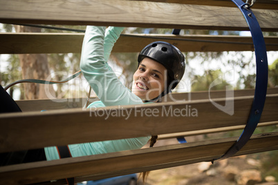 Woman sliding on wooden slide