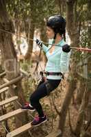 Woman on zipline in adventure park