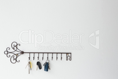 Various keys hanging on hook