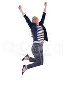 Businesswoman jumping with arms up against white background