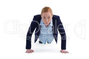 Businesswoman performing push ups