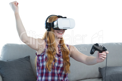 Woman playing video game with virtual reality headset