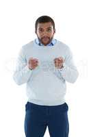 Male executive gesturing against white background