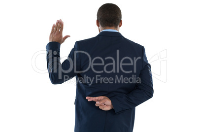 Businessman gesturing against white background
