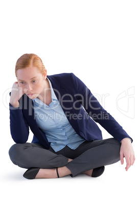 Businesswoman sitting against white background