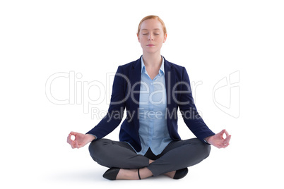 Businesswoman performing yoga