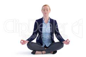 Businesswoman performing yoga