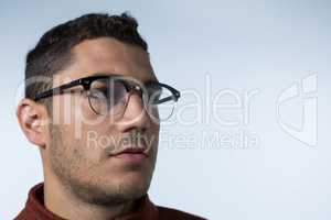 Man wearing spectacles looking sideways