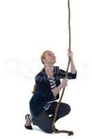 Businesswoman pulling the rope against white background
