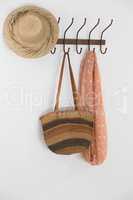 Hat, bag and scarf hanging on hook
