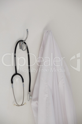 Laboratory coat and stethoscope hanging on hook