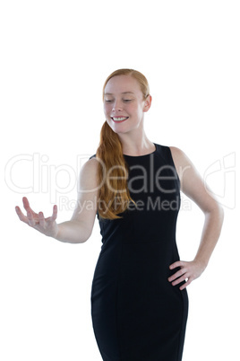 Female executive pretending to hold an invisible object