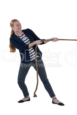 Businesswoman pulling the rope against white background