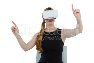 Female executive using virtual reality headset