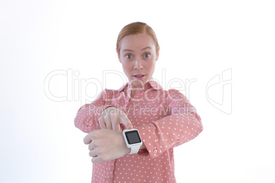 Businesswoman pointing at her smartwatch