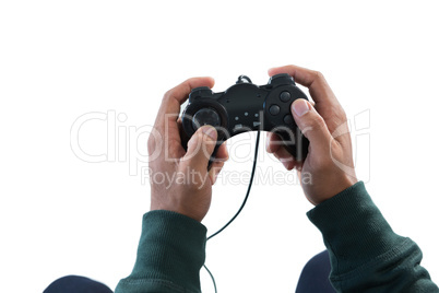 Man playing video game against white background