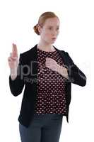 Female executive gesturing against white background