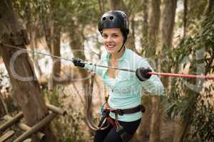 Woman on zipline in adventure park