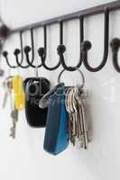 Close-up of various keys hanging on hook