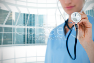 Composite image of doctor listening with stethoscope