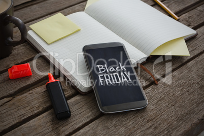 Composite image of organizer, coffee, mobile phone and stationery on wooden plank
