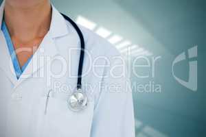 Composite image of doctor wearing lab coat with stethoscope