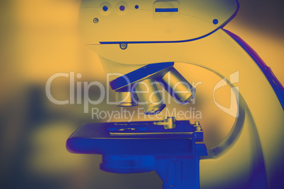 Composite image of microscope in laboratory